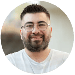 Luis is a smiling, middle-aged hispanic man with a mustache and beard.